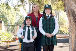 Mother and her two children at St Peter Chanel Catholic Primary School Regents Park